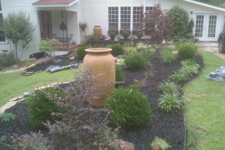 Designed front yard with ornamental urn